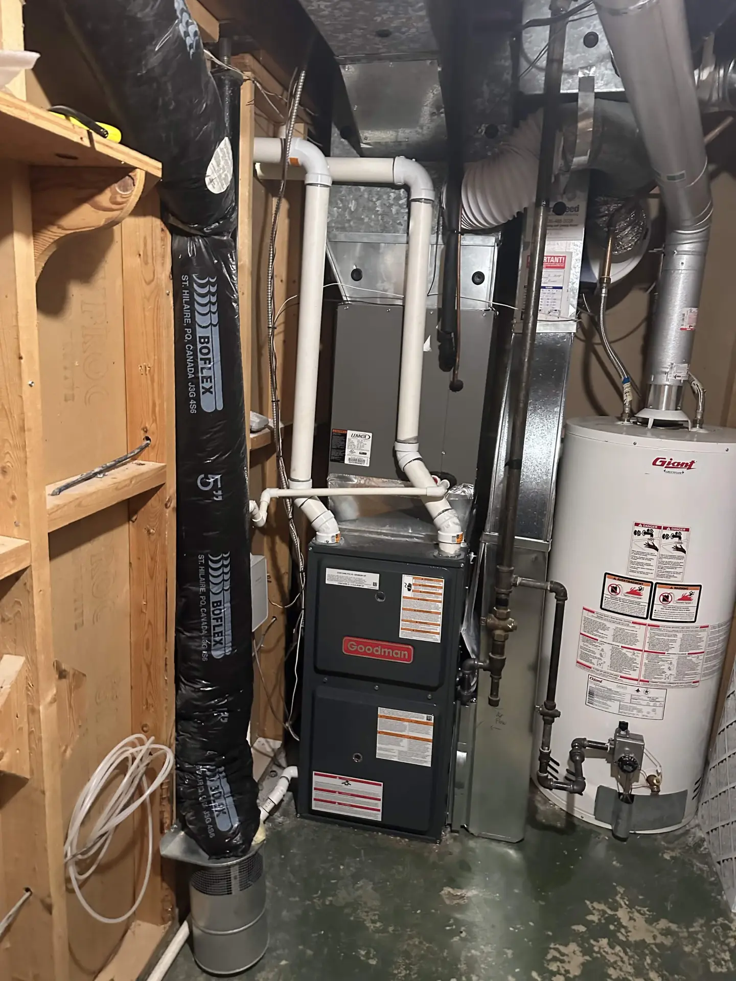 Goodman furnace and hot water tank installation in a sample home