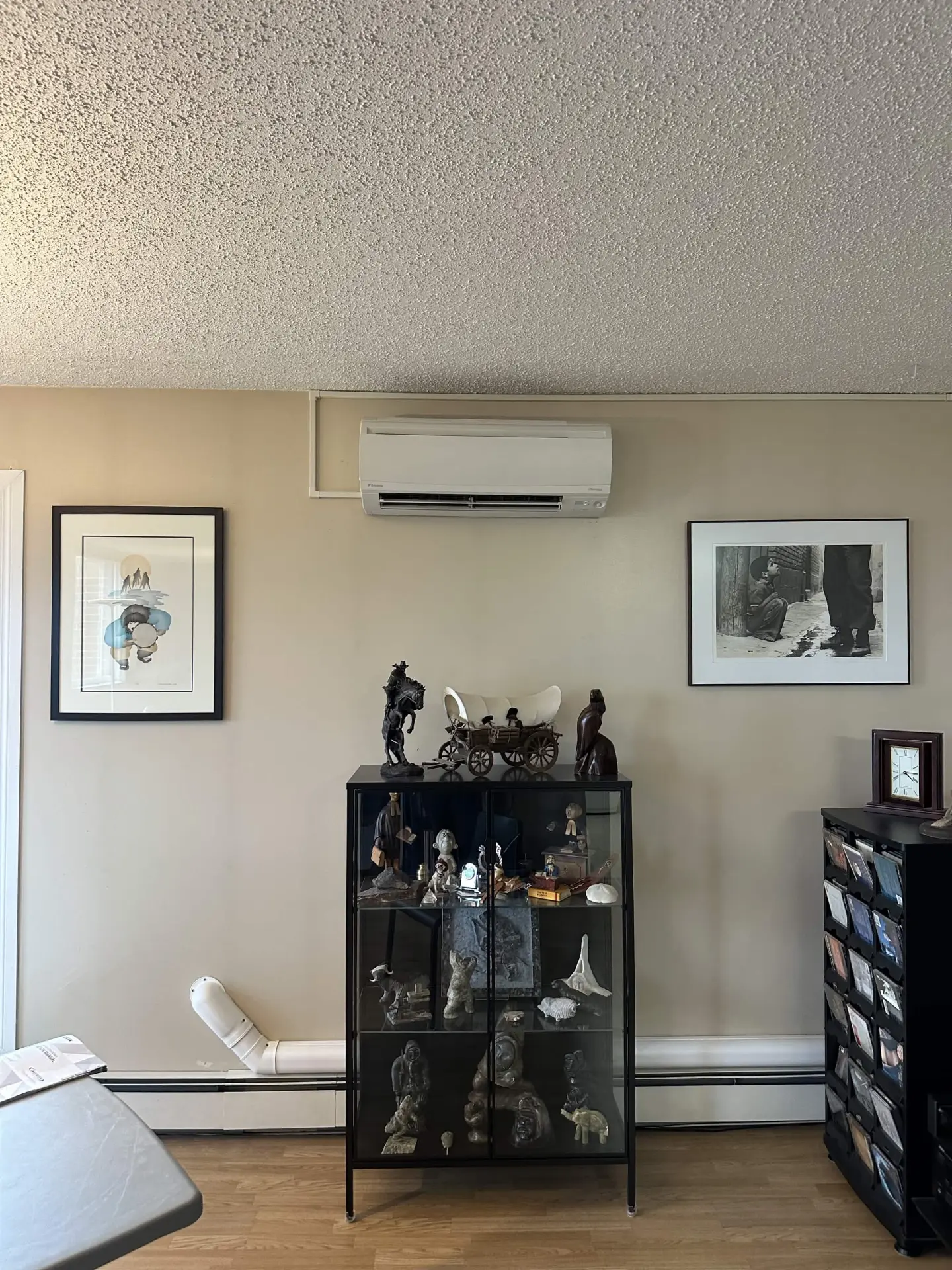 Wall-mounted indoor mini-split head in a residential living room