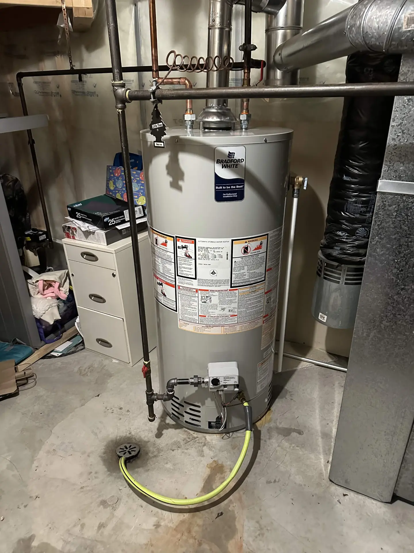 Bradford White atmospheric water heater with gas and vent connections